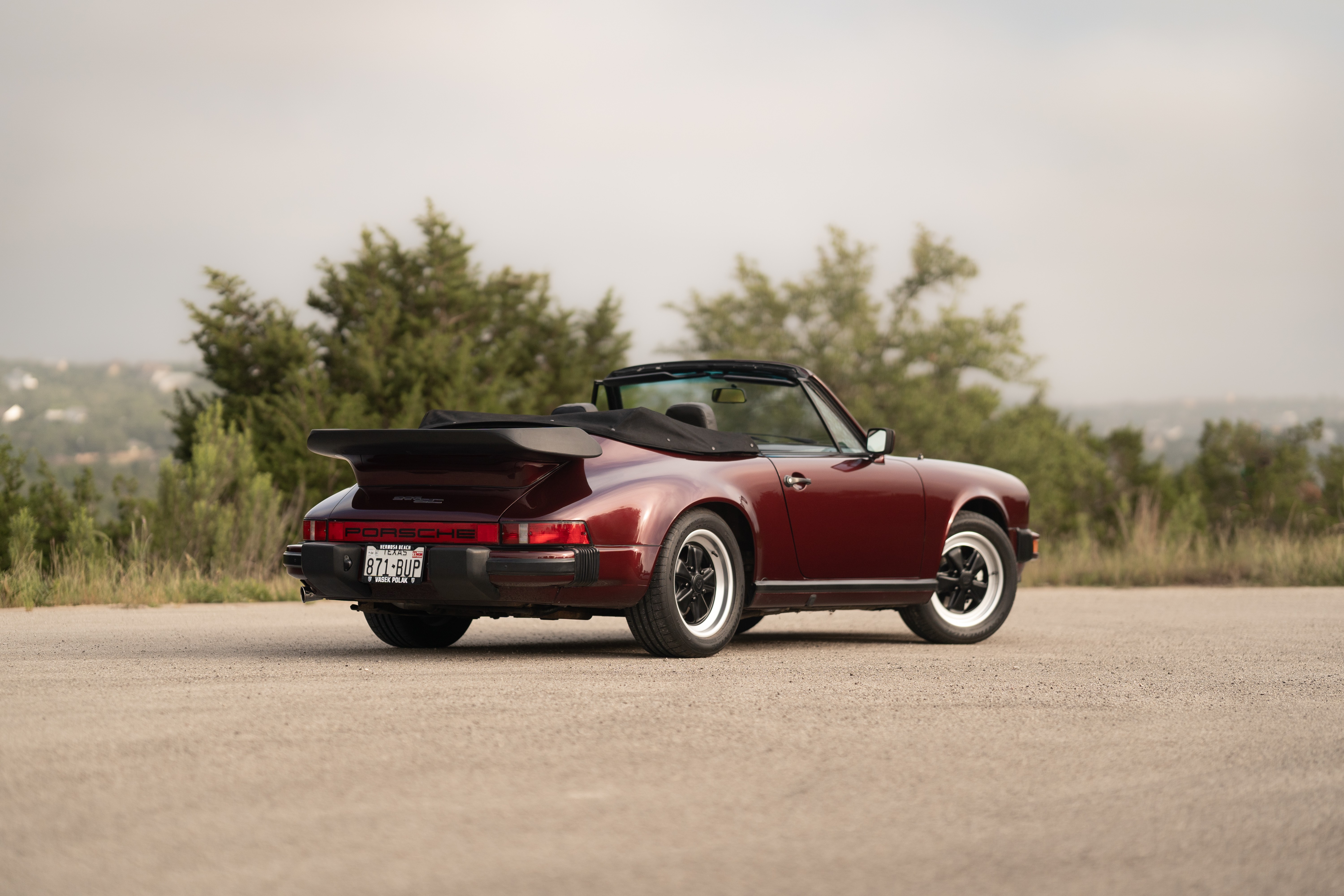 1983 Porsche 911SC Cabriolet in Metallic Red shot in Austin, TX.