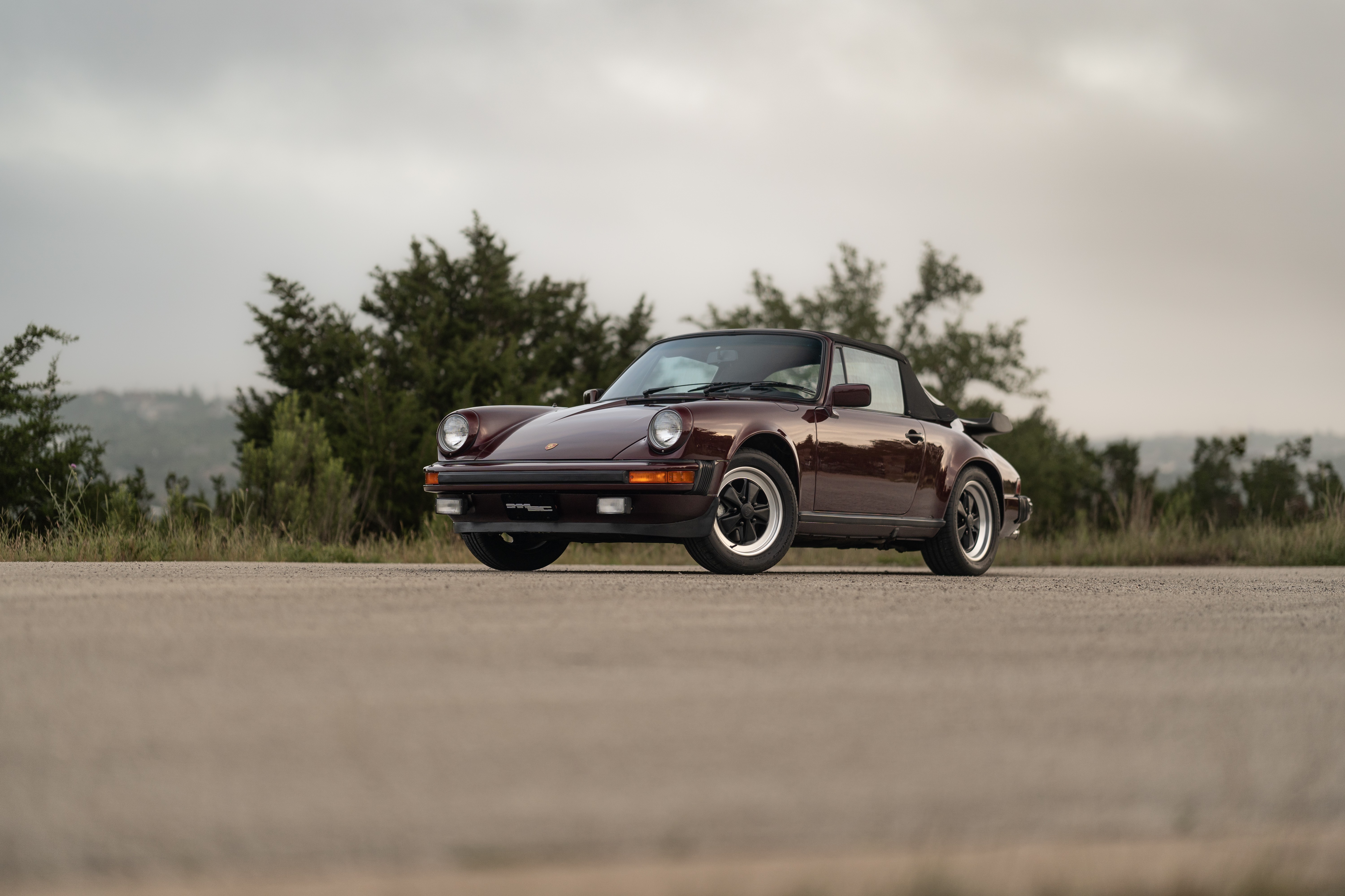 1983 Porsche 911SC Cabriolet in Metallic Red shot in Austin, TX.