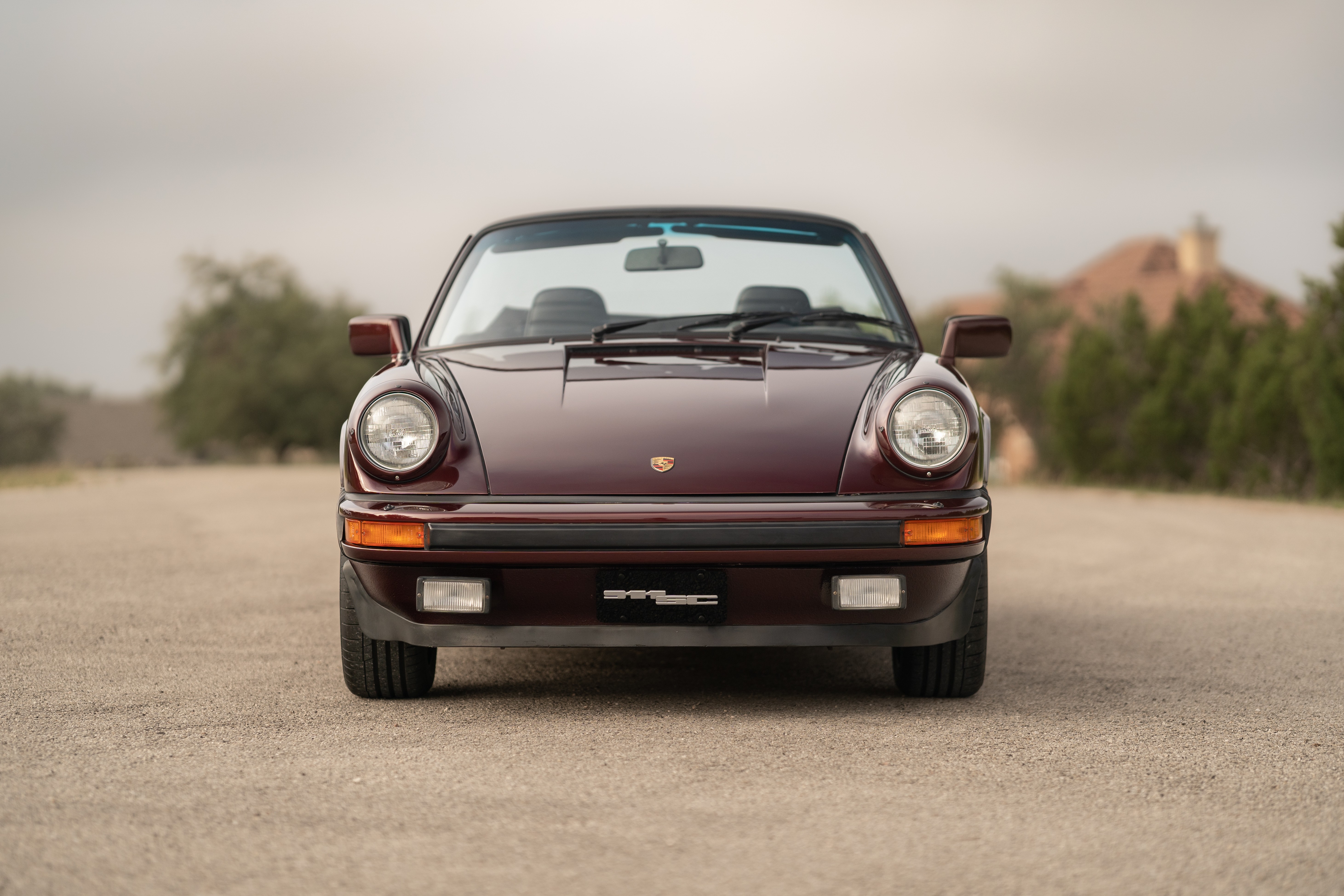 1983 Porsche 911SC Cabriolet in Metallic Red shot in Austin, TX.