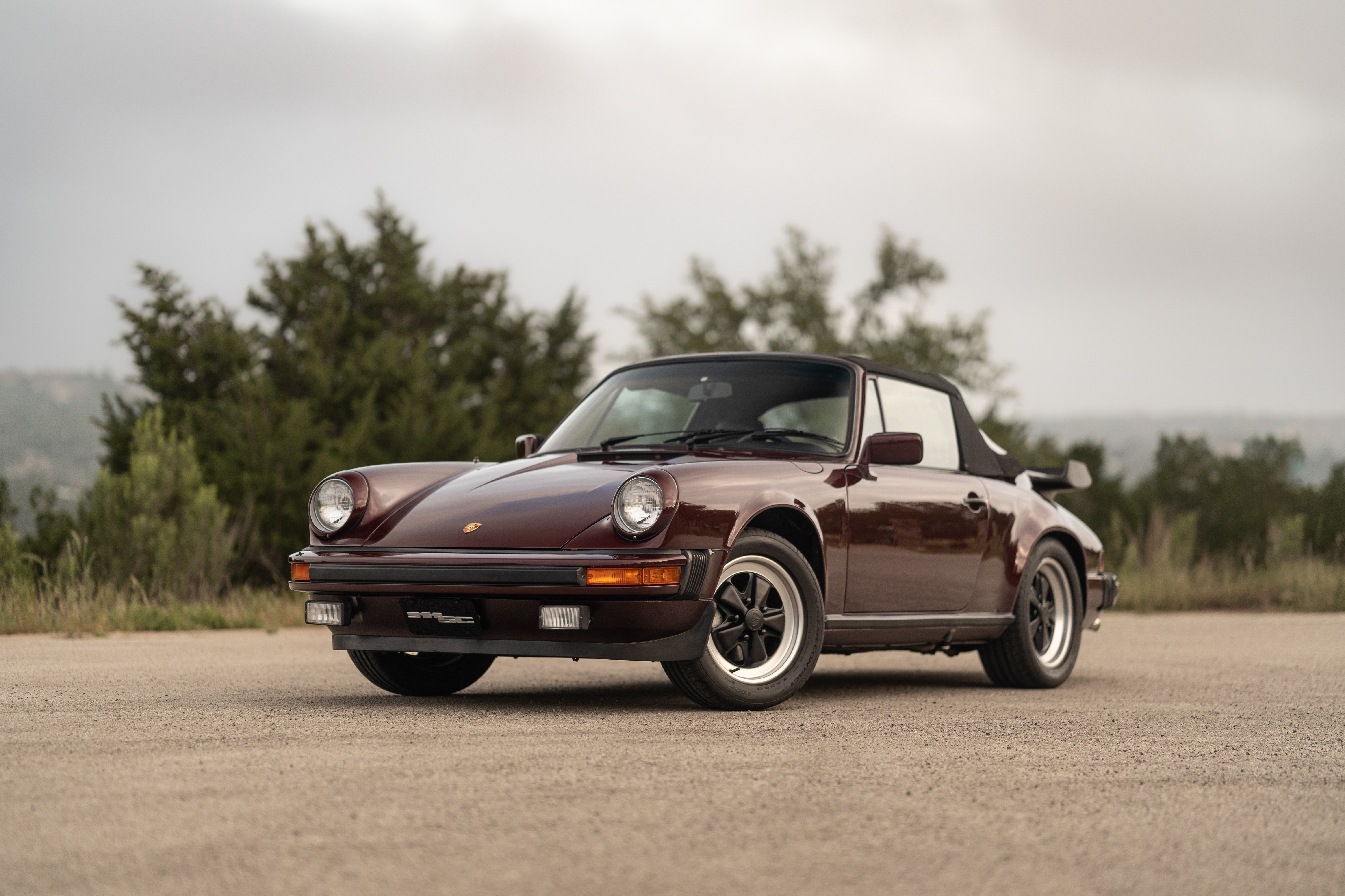 1983 Porsche 911SC Cabriolet in Metallic Red shot in Austin, TX.