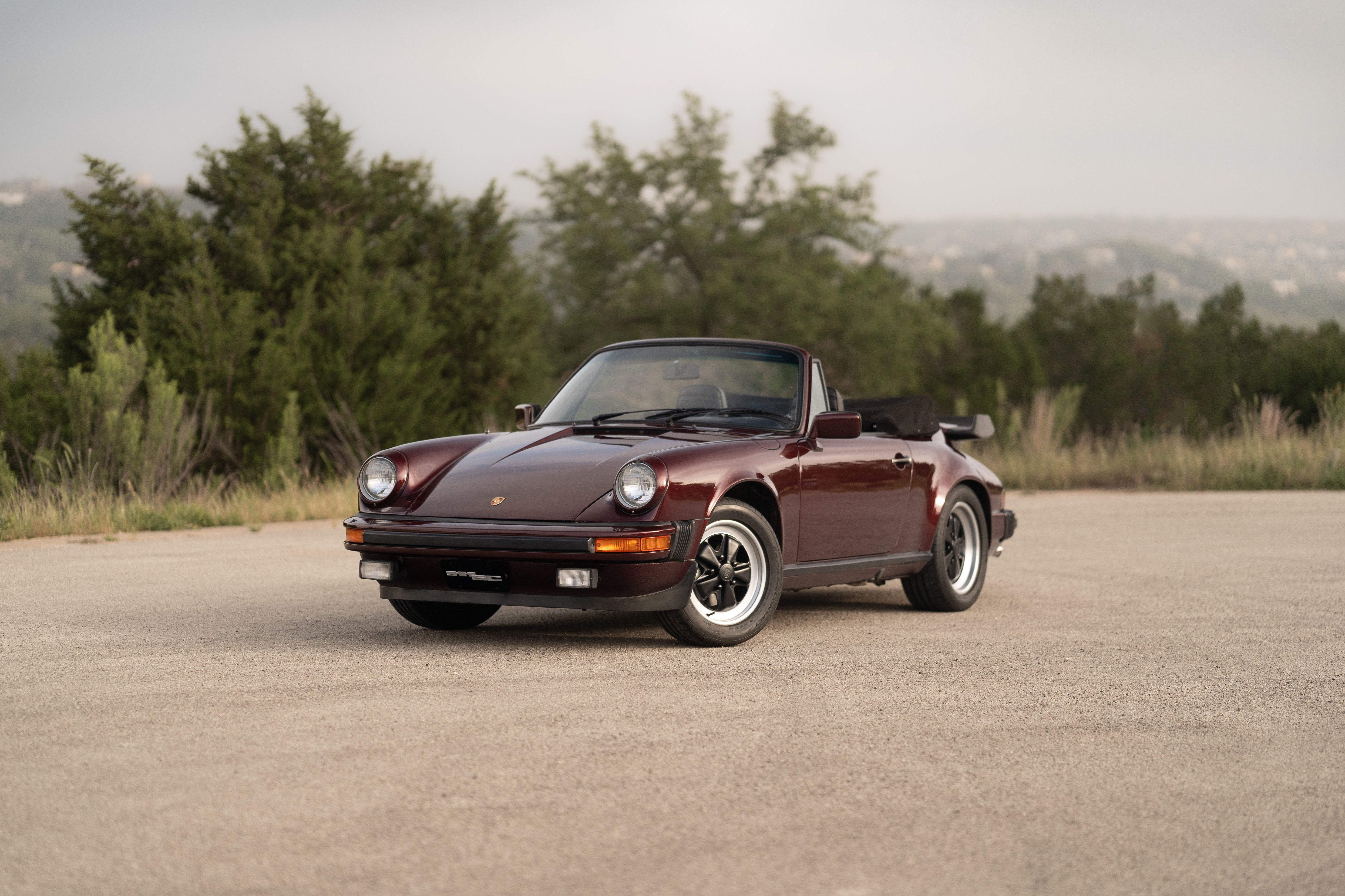 1983 Porsche 911SC Cabriolet in Metallic Red shot in Austin, TX.