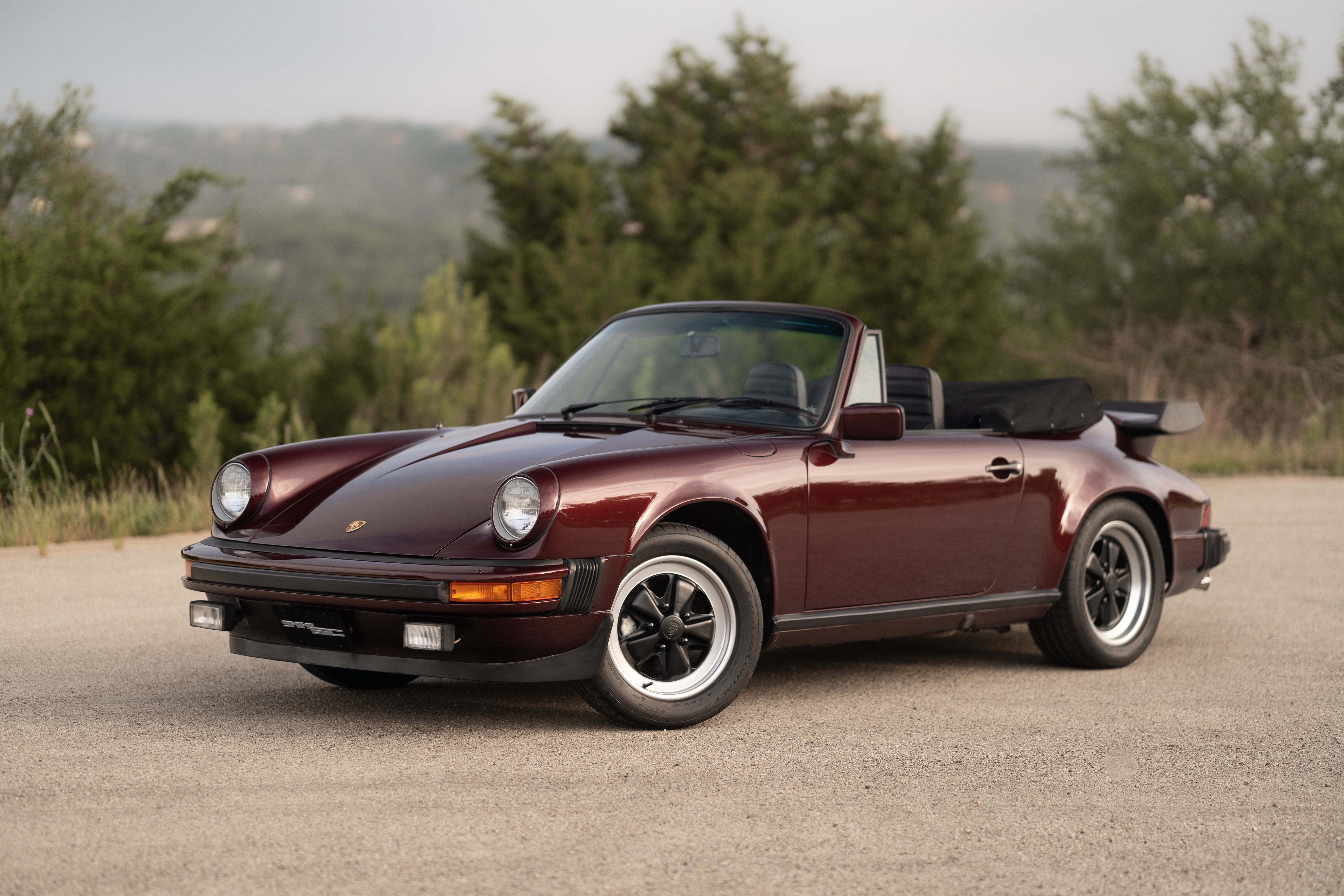 1983 Porsche 911SC Cabriolet in Metallic Red shot in Austin, TX.