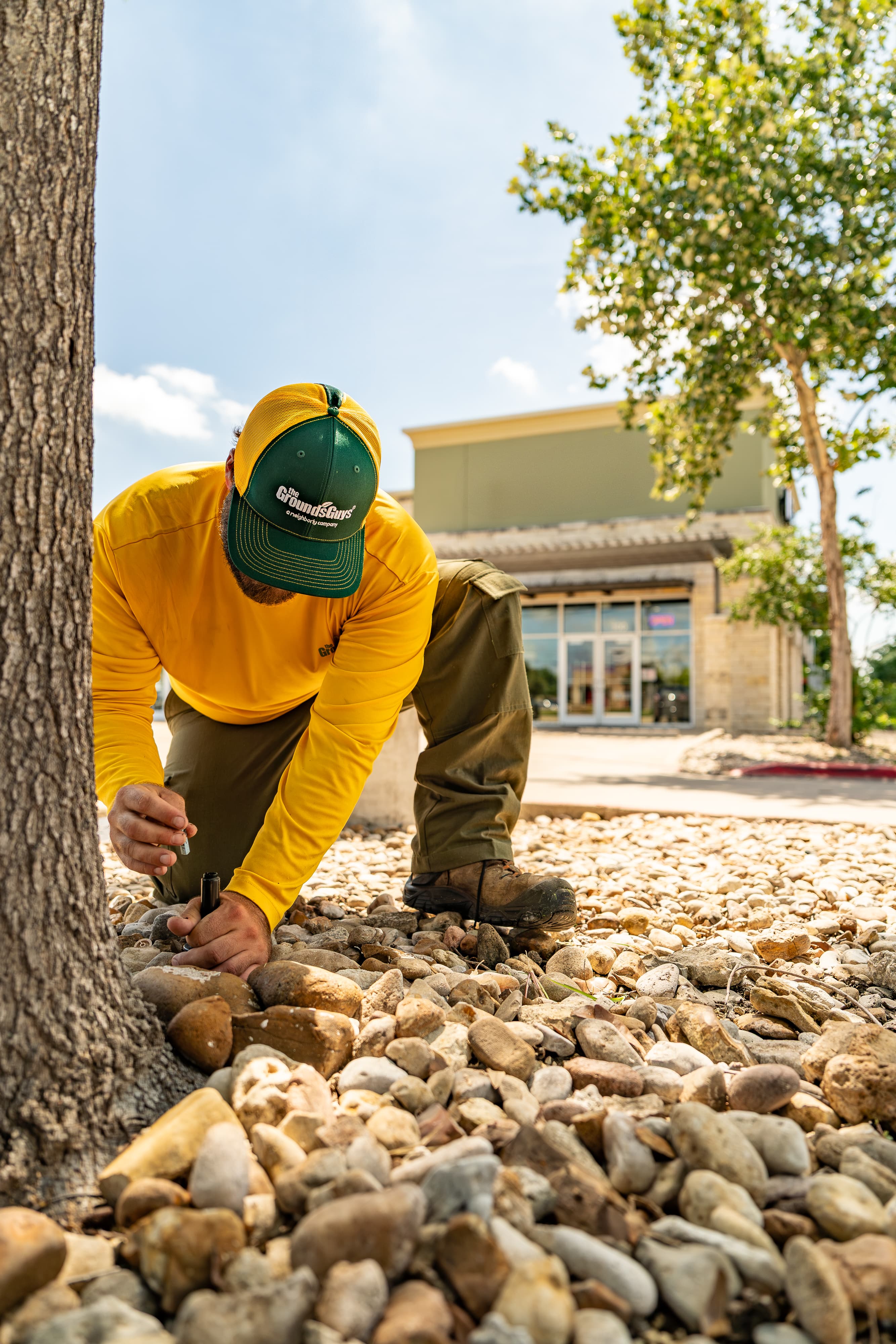 Grounds Guys maintenance crew working on a commercial landscaping project.