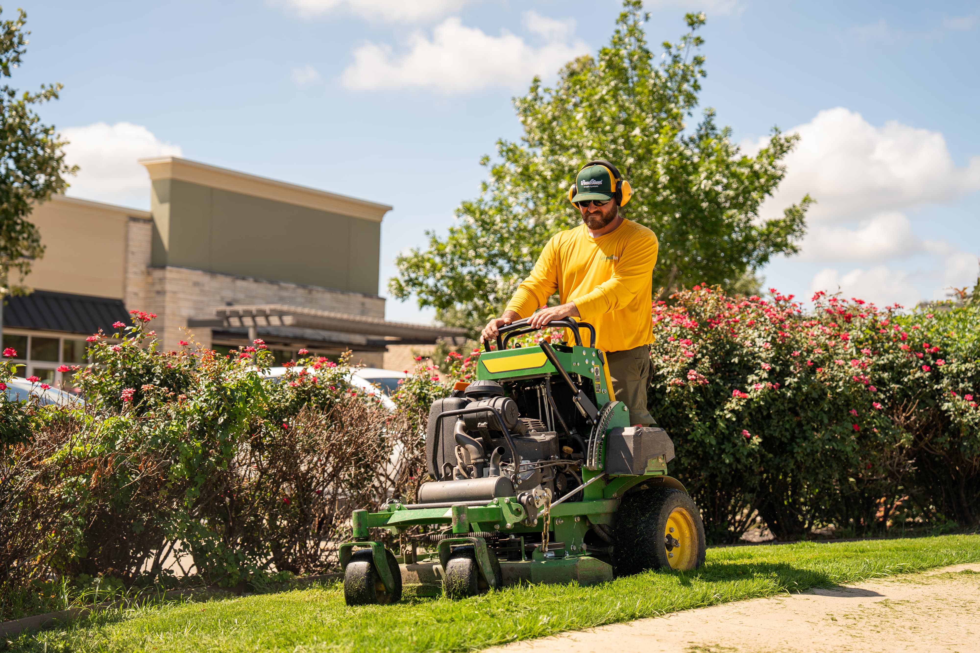 Grounds Guys maintenance crew working on a commercial landscaping project.