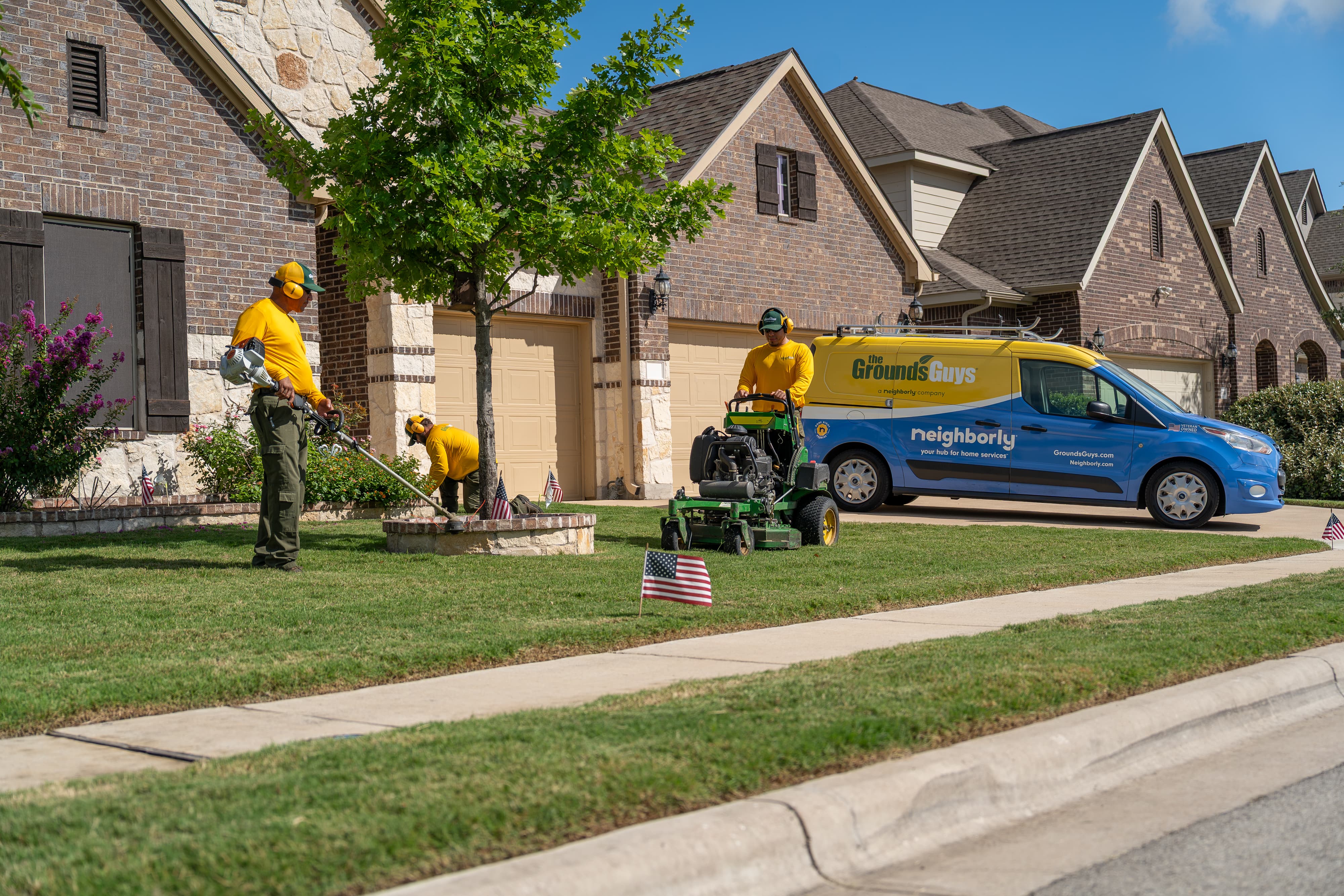 Grounds Guys maintenance crew at a customers house.