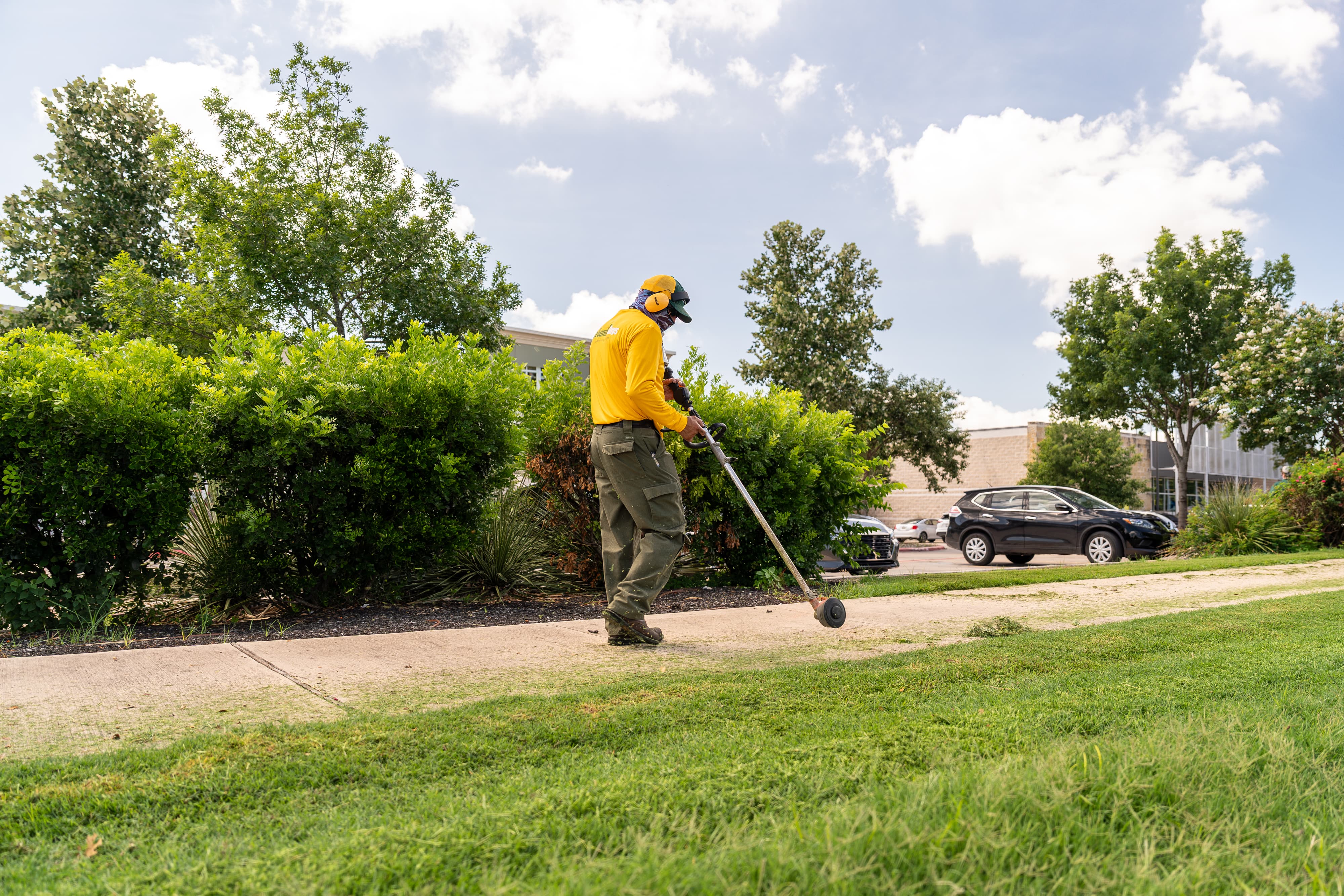 Grounds Guys maintenance crew working on a commercial landscaping project.