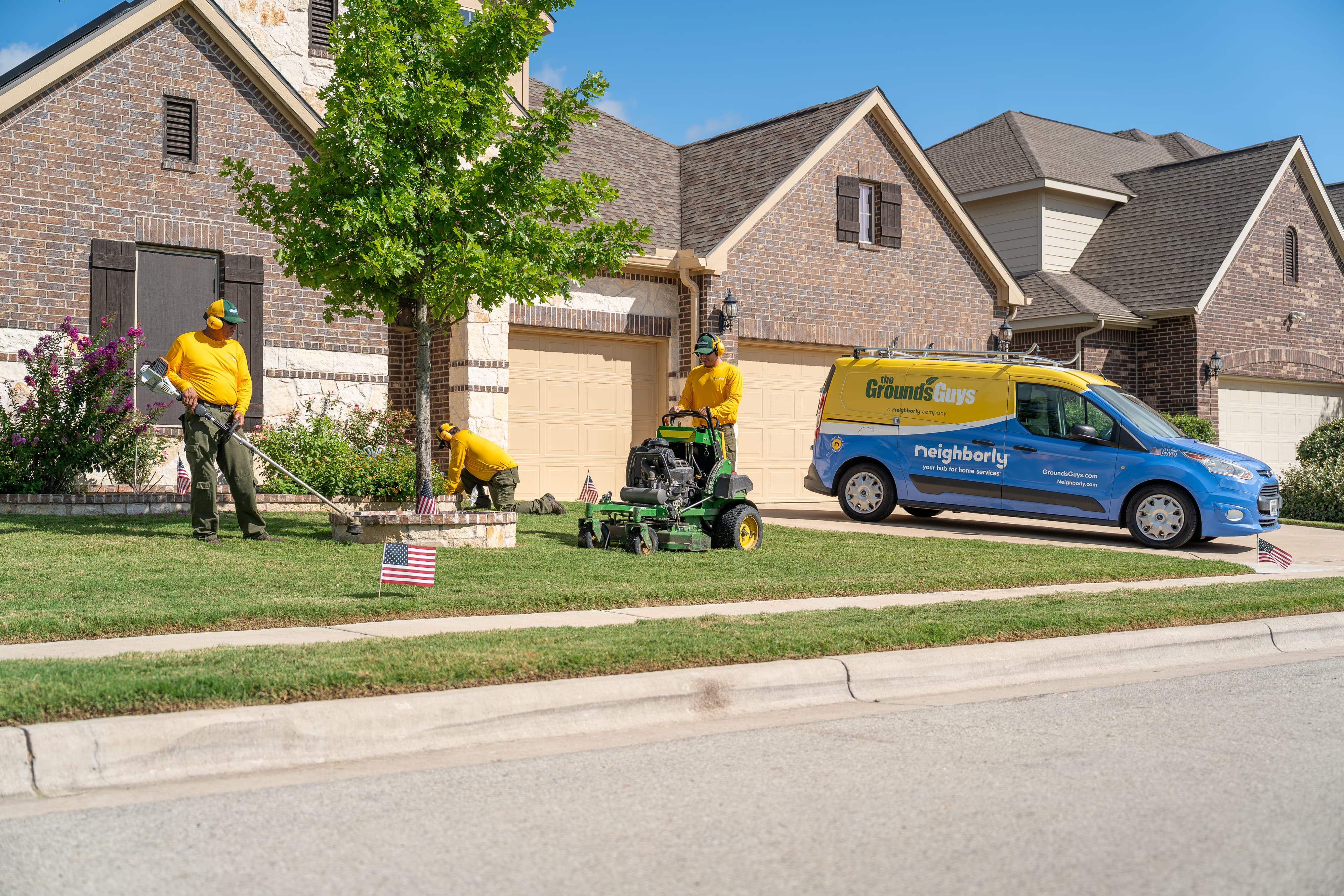 Grounds Guys maintenance crew at a customers house.