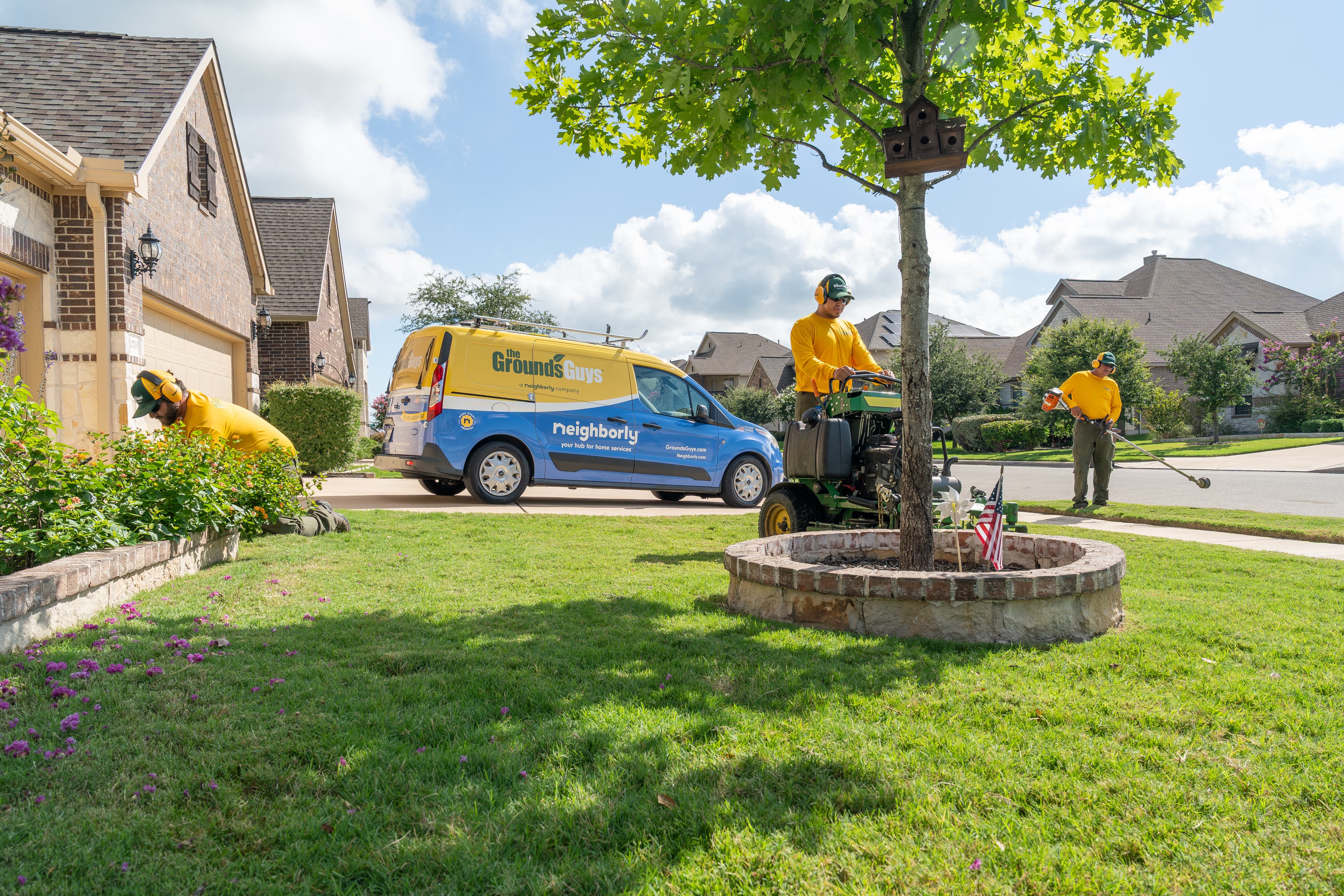 Grounds Guys maintenance crew at a customers house.
