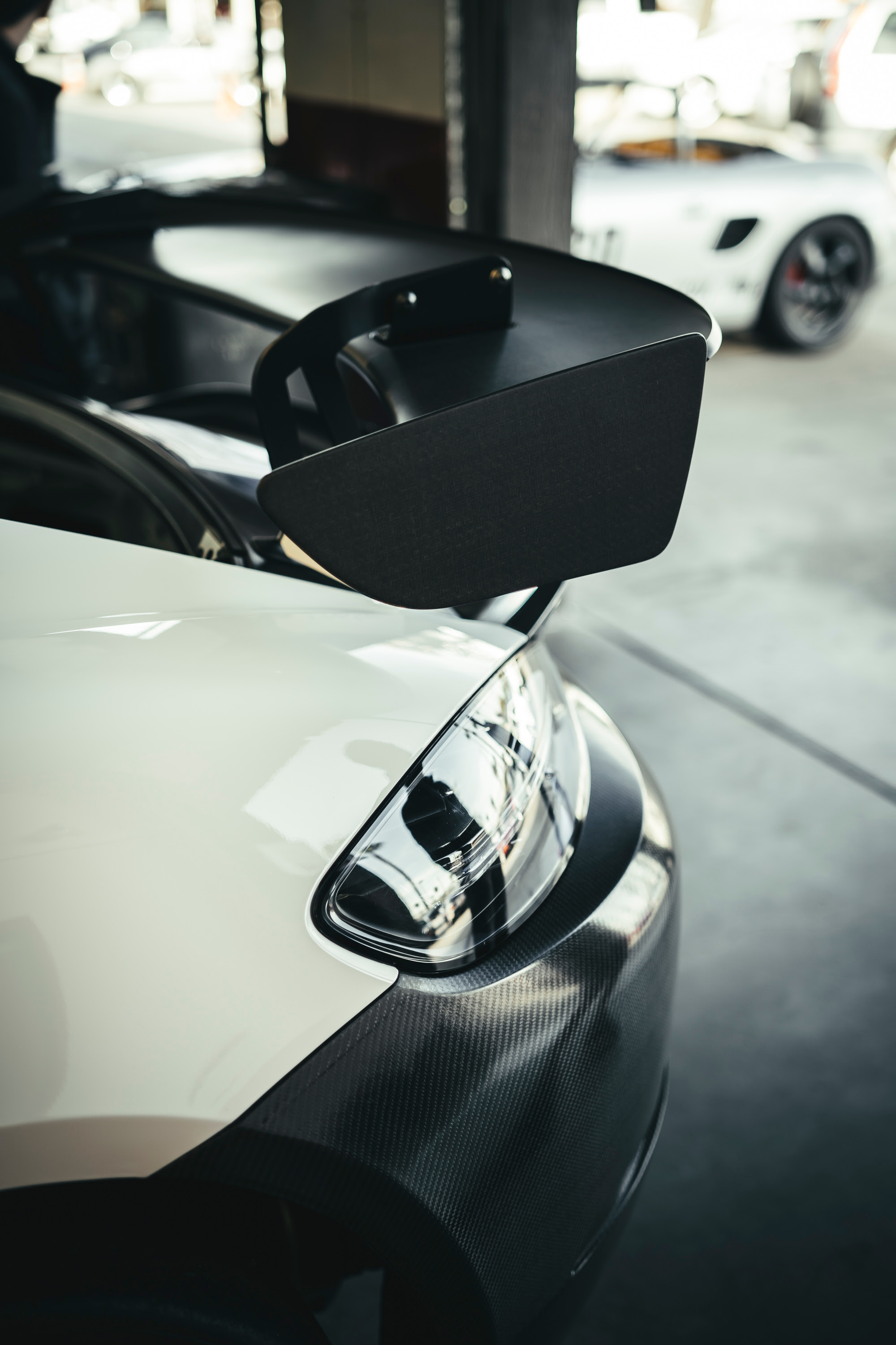 The carbon panels and rear wing on a Porsche GT4 Clubsport MR at Callas Rennsport.