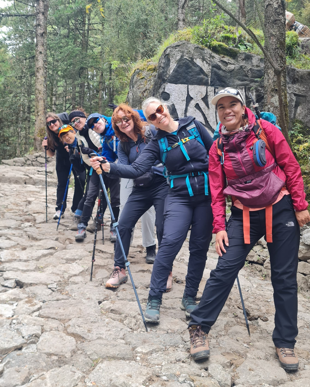 Local-guide-Pooja-Giri-and-group-of-trekkers-on-EBC-trek---The-Adventure-People.png