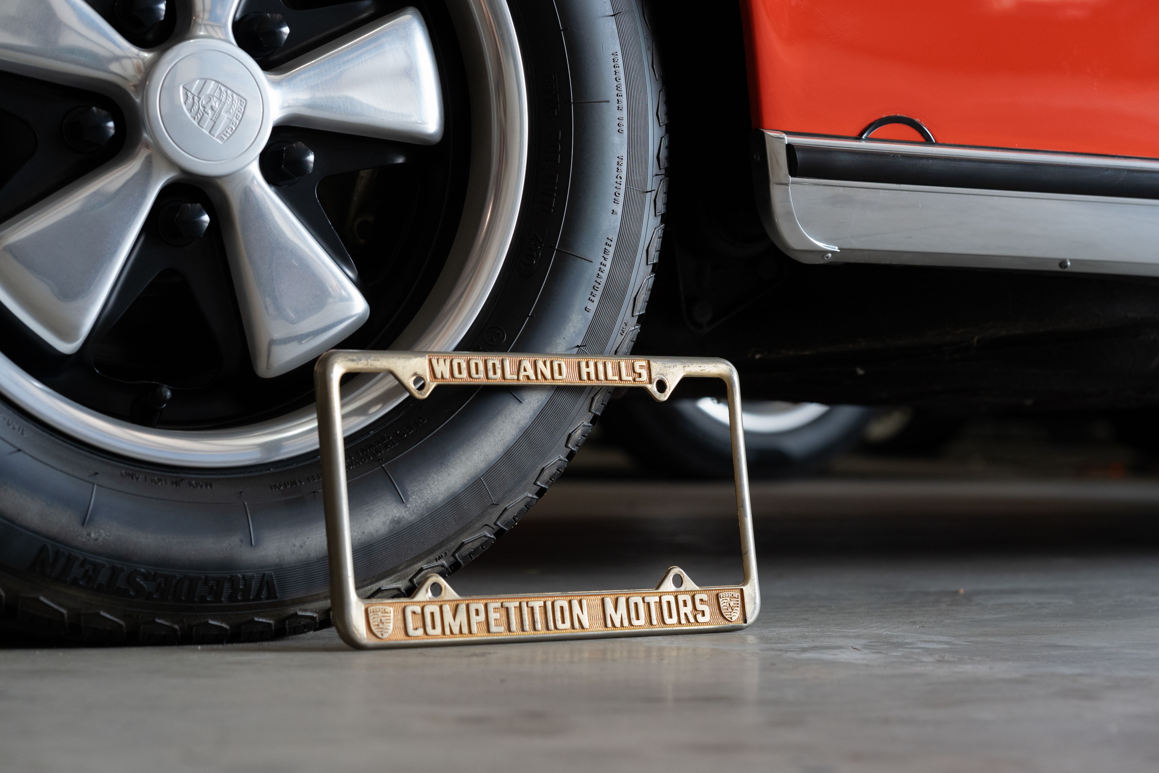 An ultra-rare Competition Motors gold plate frame.