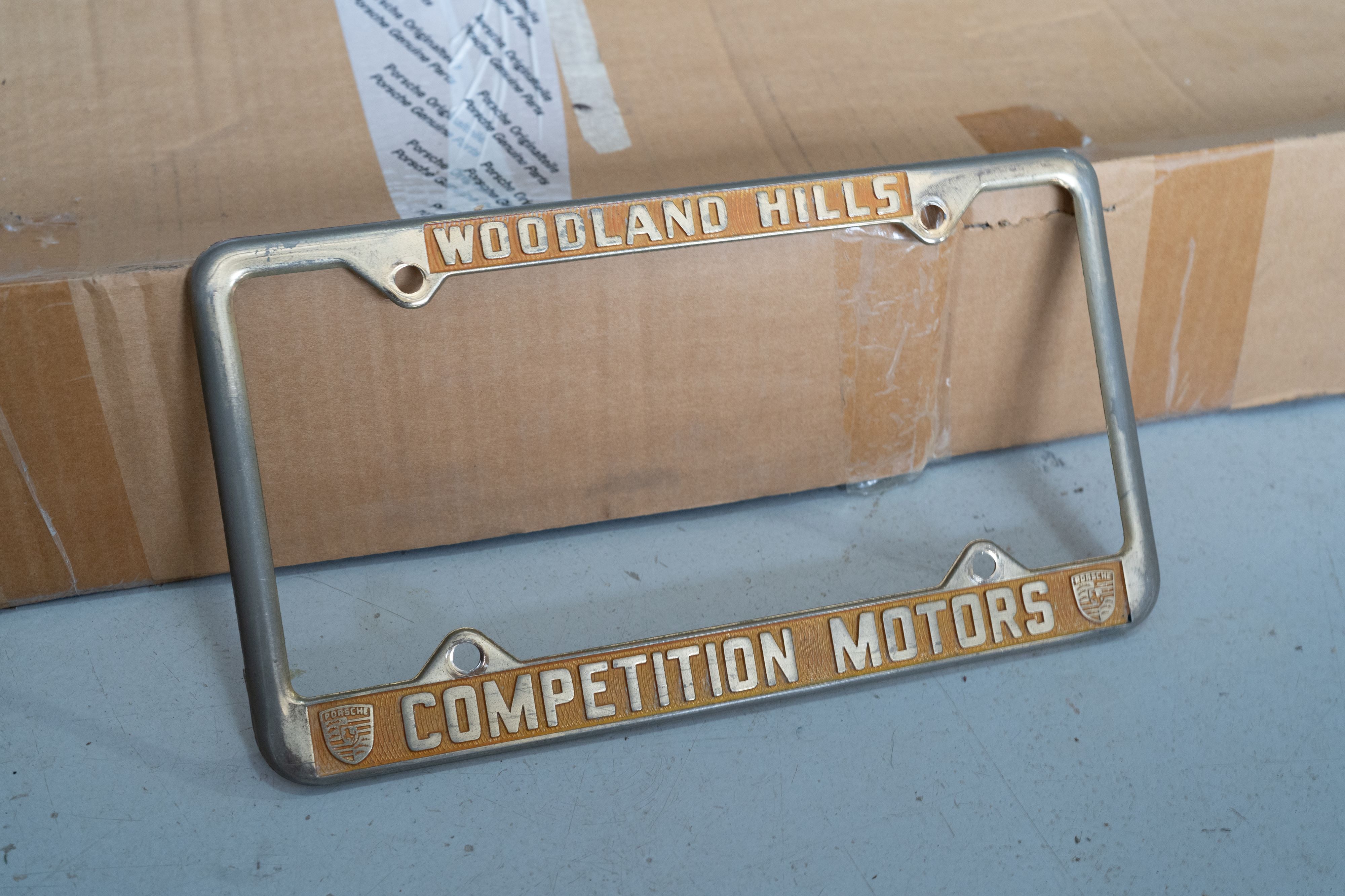 An ultra-rare Competition Motors gold plate frame.