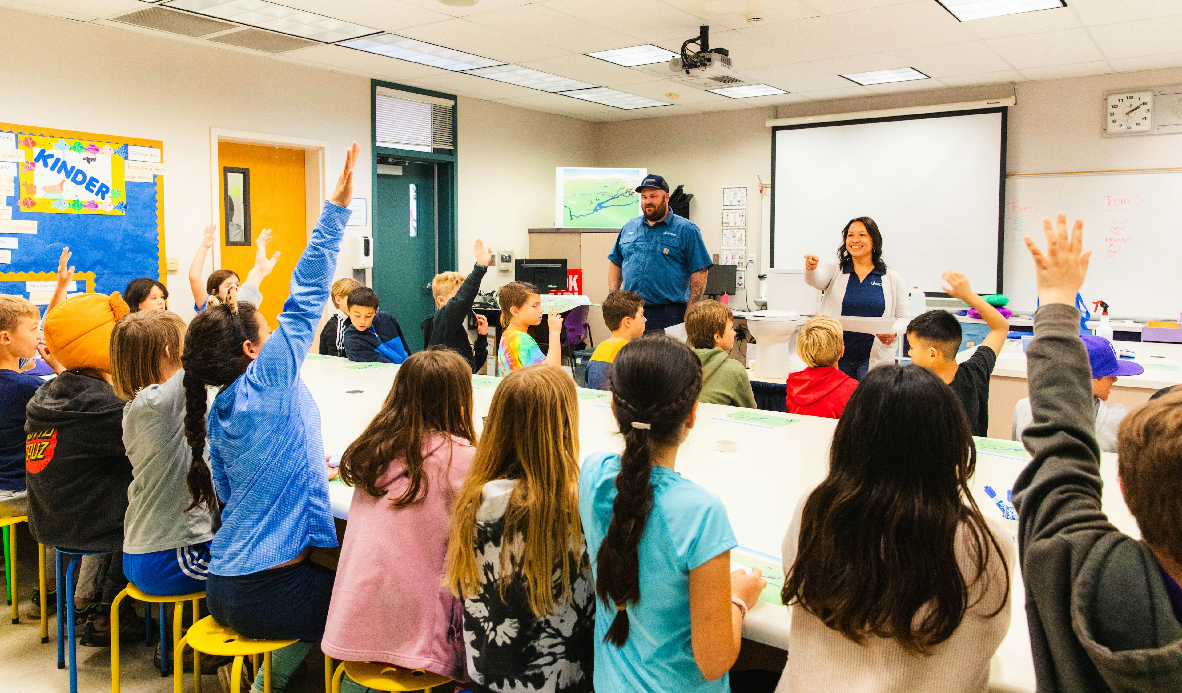 PCWA staff speaking with children in classroom