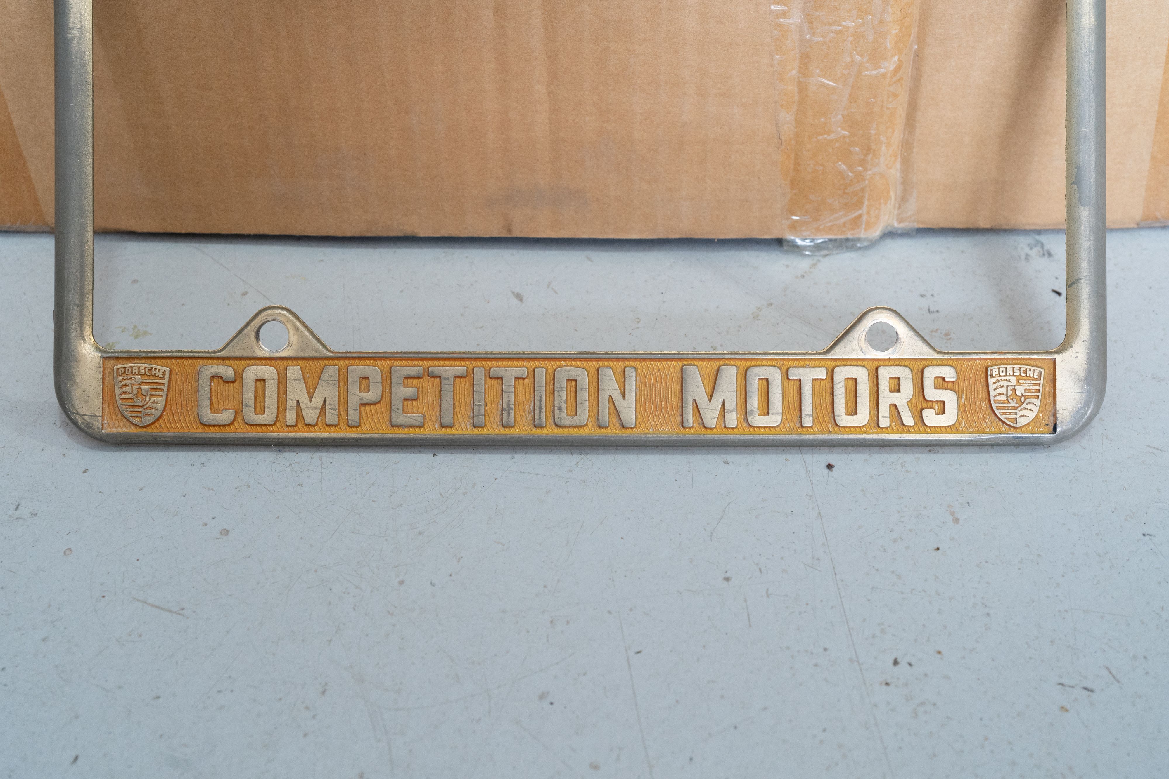 An ultra-rare Competition Motors gold plate frame.