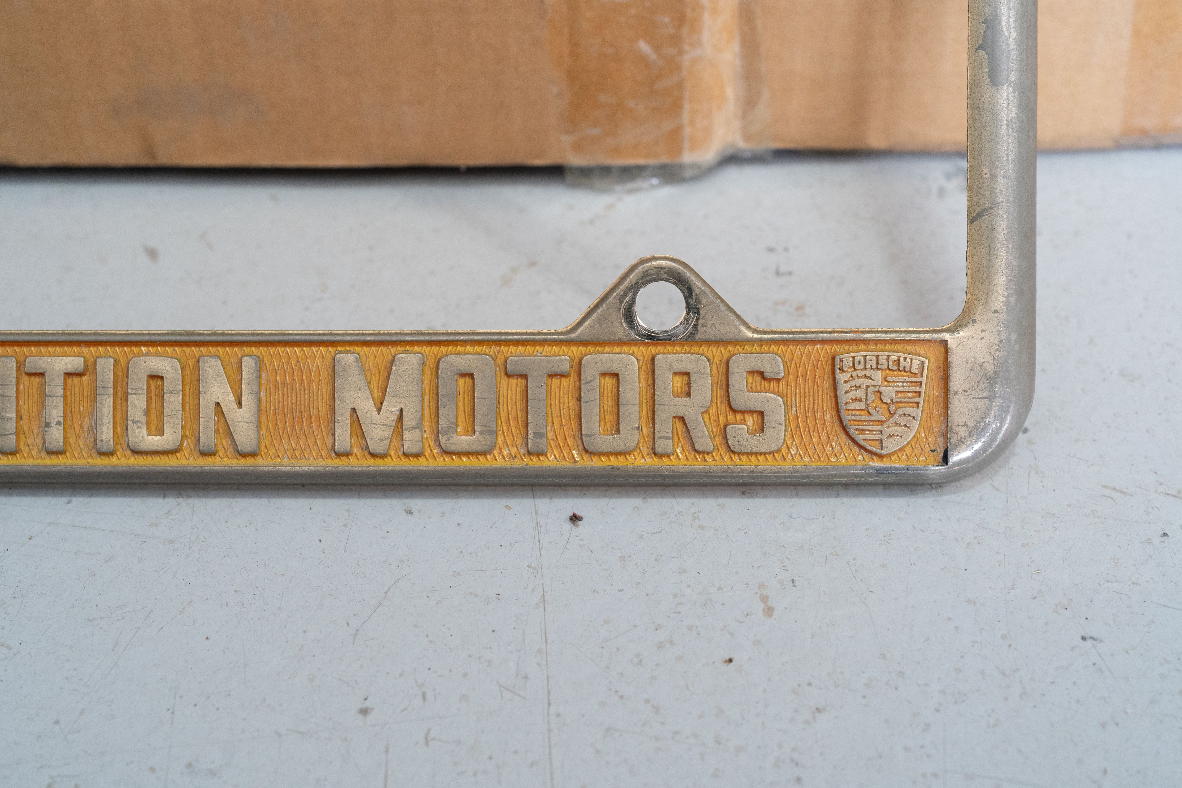 An ultra-rare Competition Motors gold plate frame.