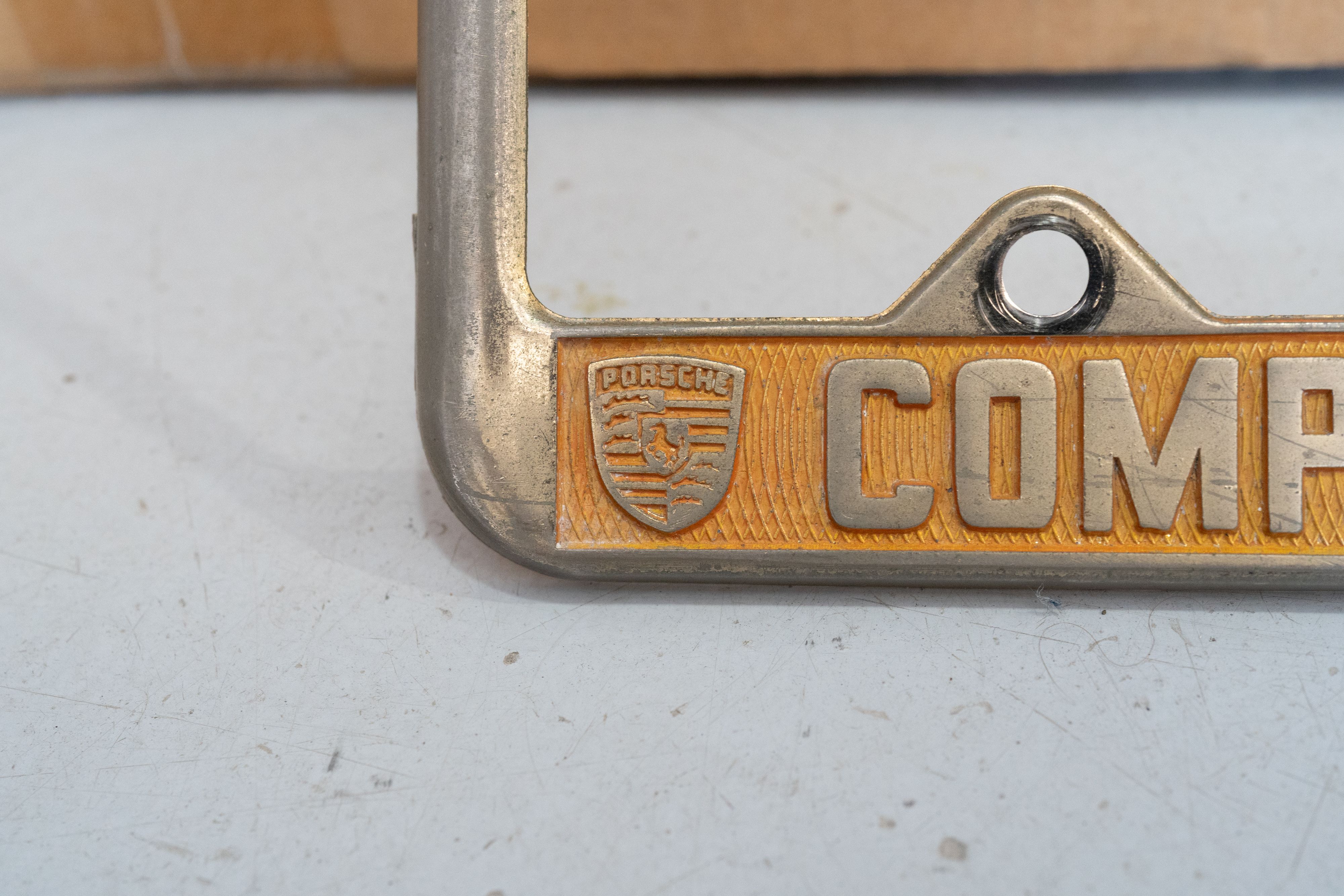 An ultra-rare Competition Motors gold plate frame.