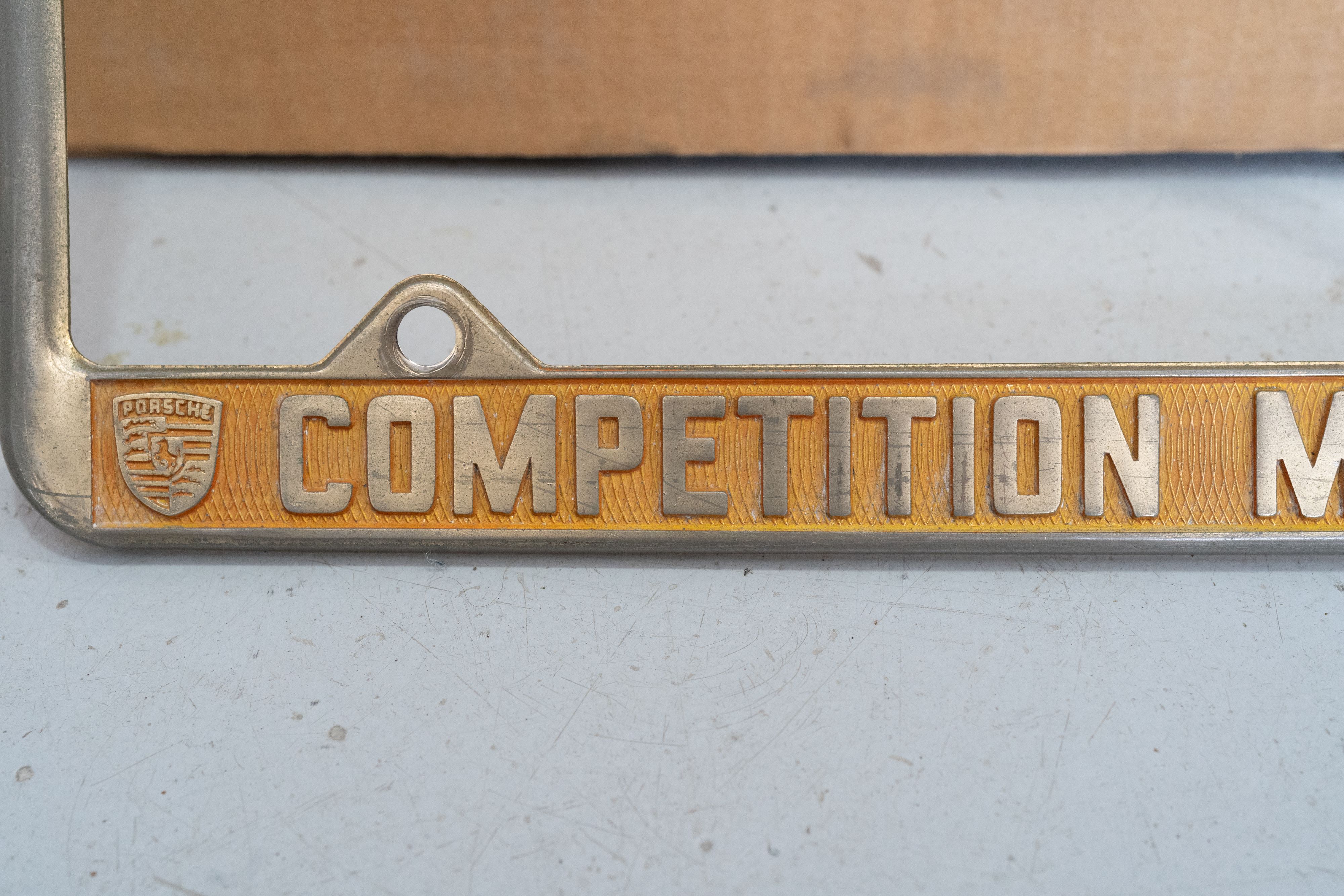 An ultra-rare Competition Motors gold plate frame.