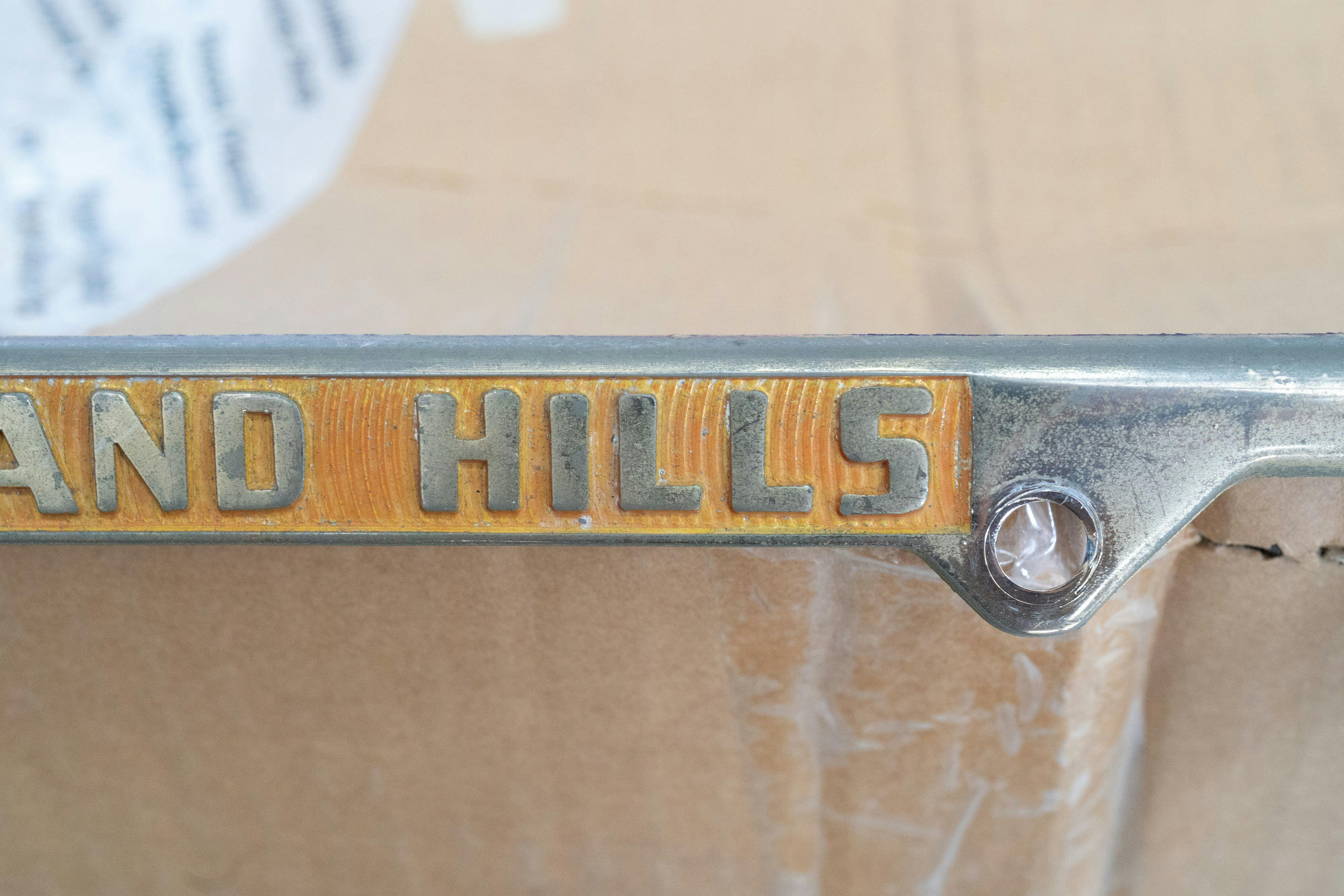 An ultra-rare Competition Motors gold plate frame.