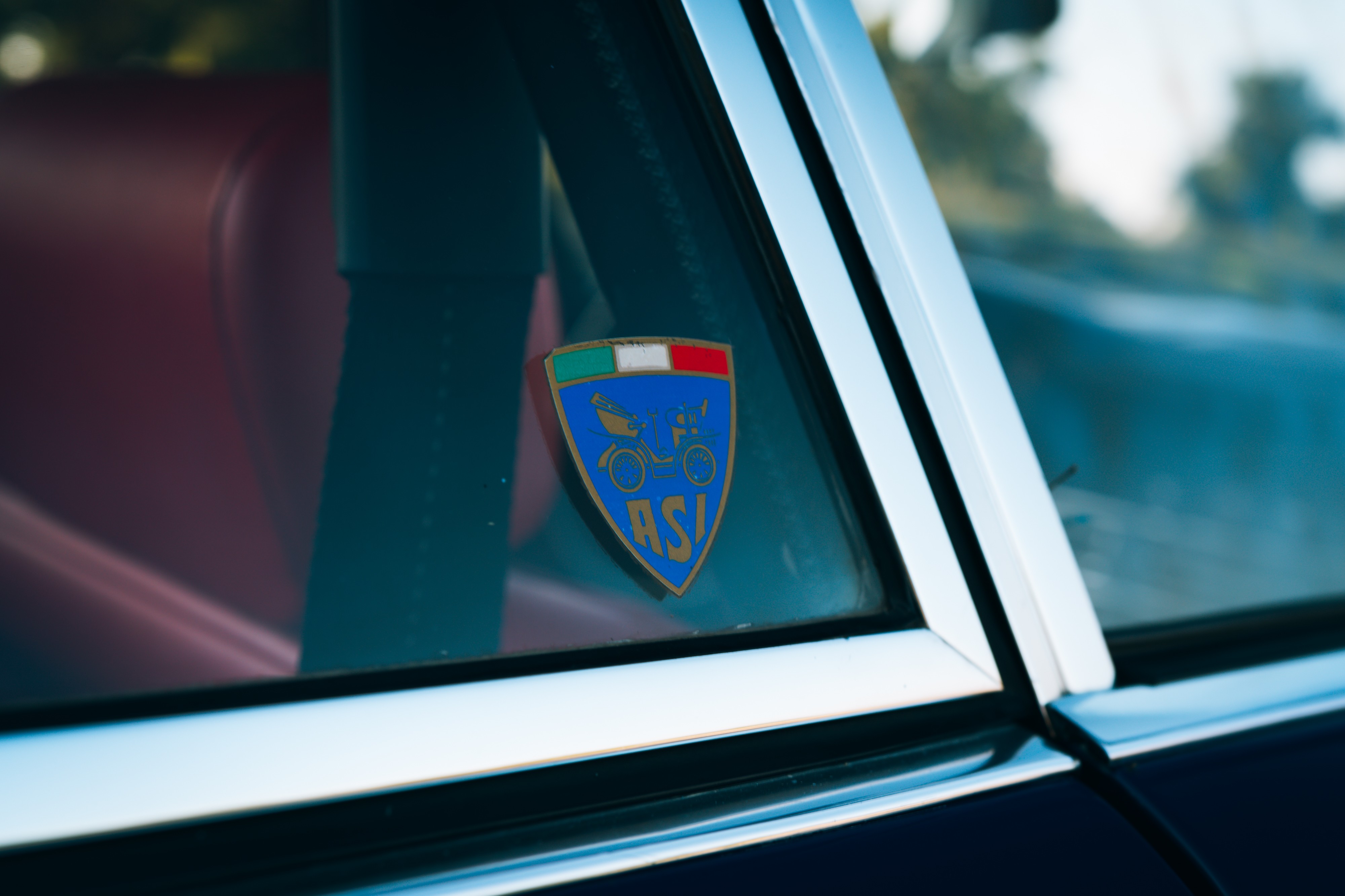 ASI sticker on a 1969 Porsche 911S in Ossi Blue over Red.