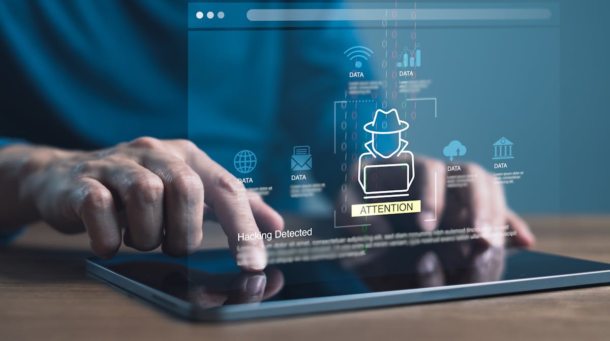 man on tablet discovering identity theft