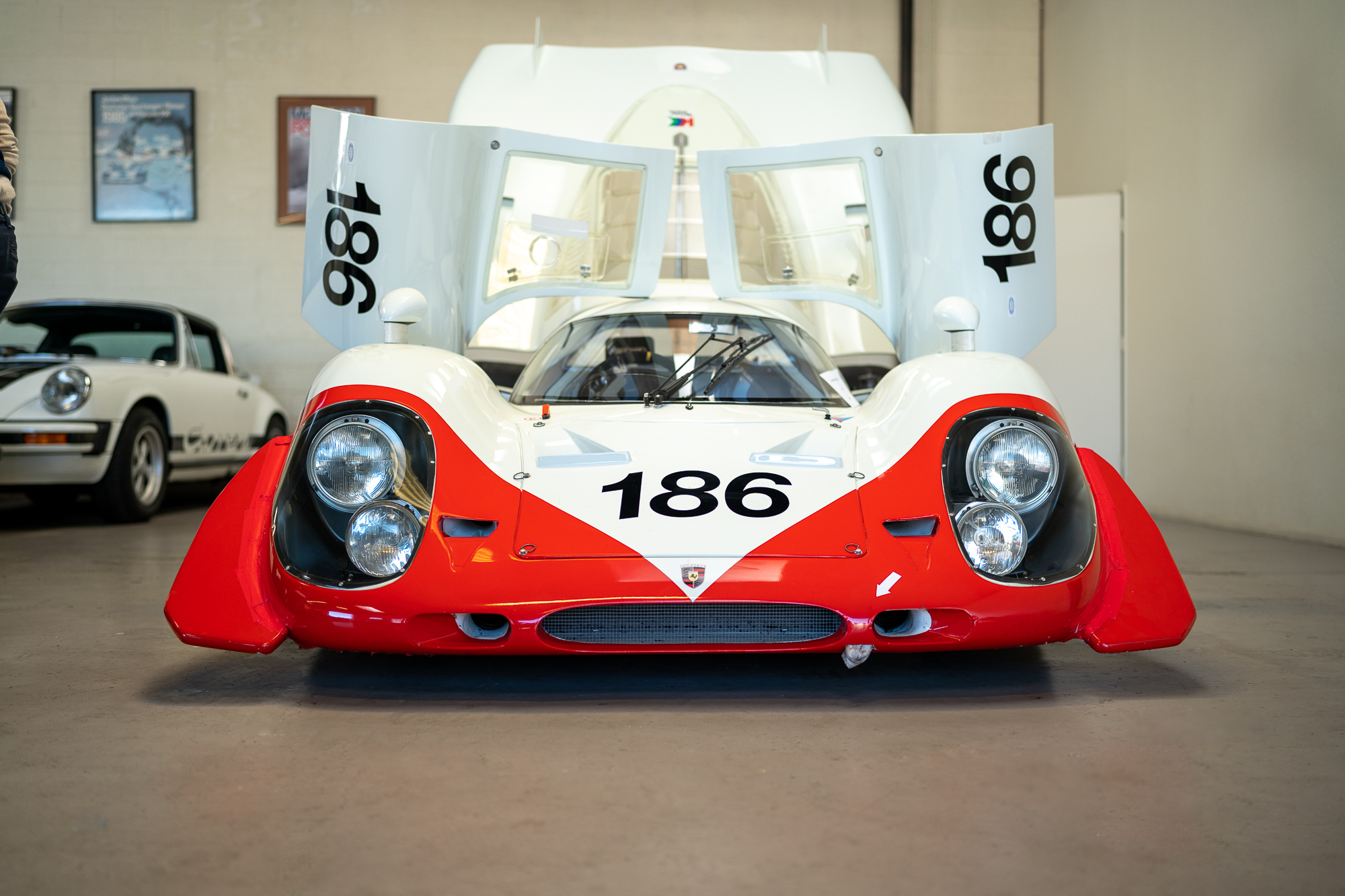 A frontend of a Porsche 917 LH with the doors open