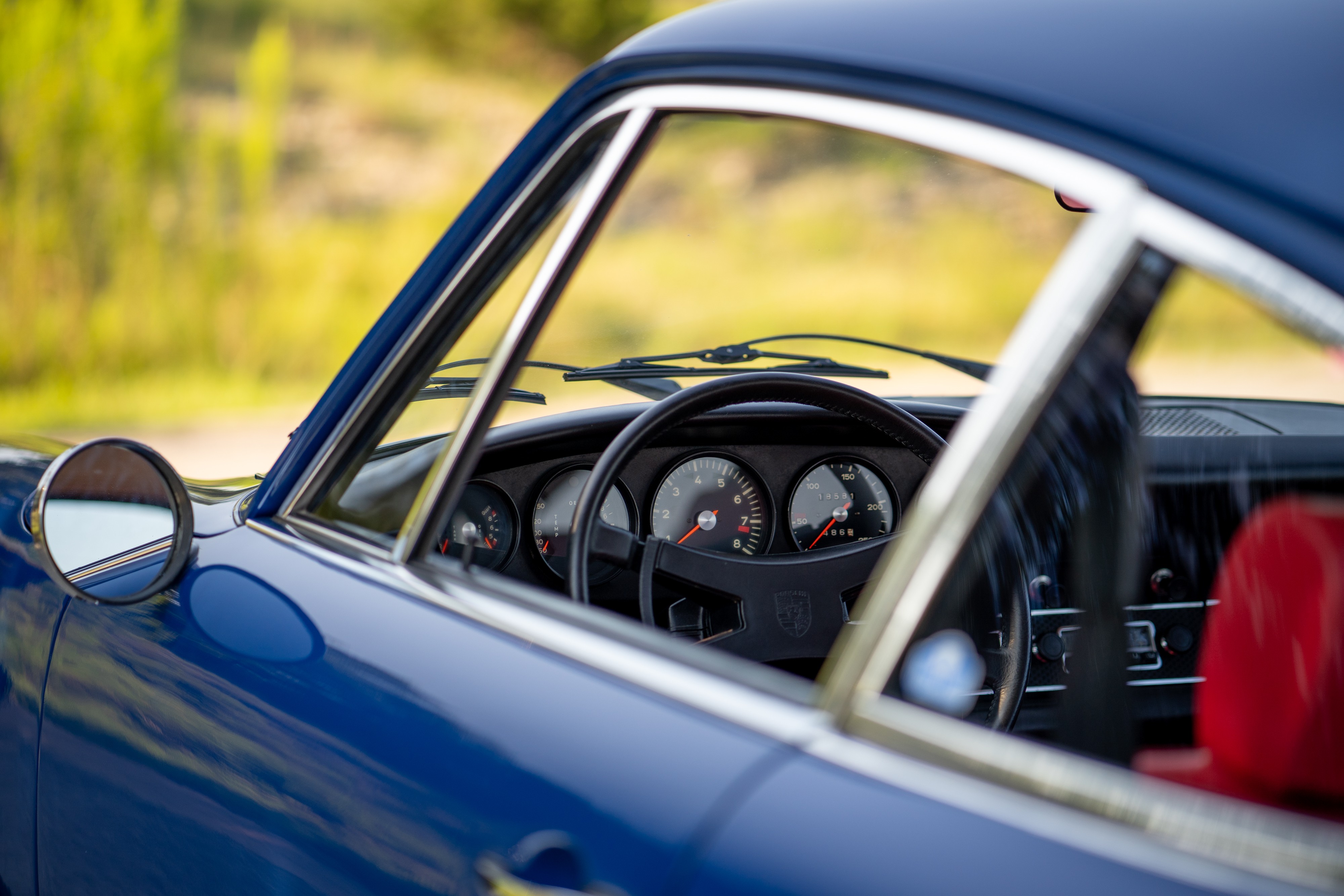 Gagues on a 1969 Porsche 911S in Ossi Blue over Red.